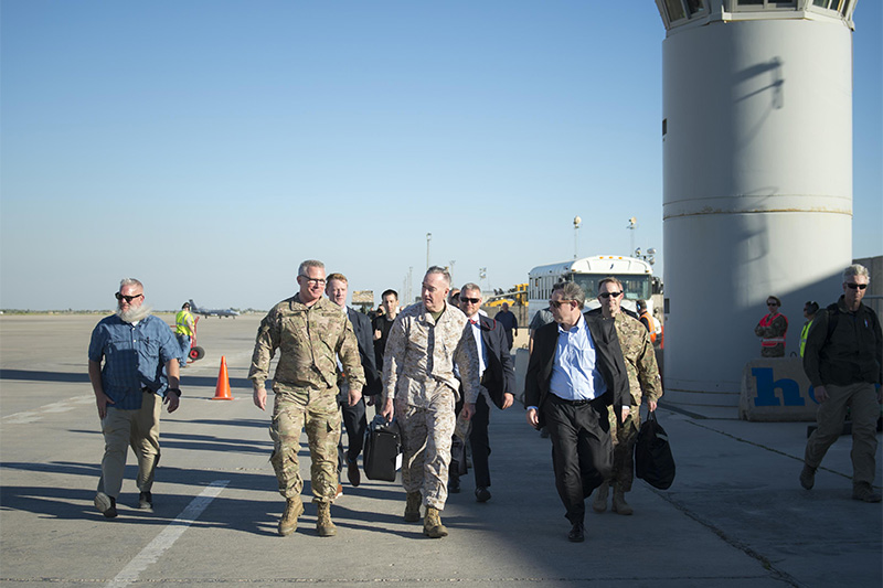 Marine Corps Gen. Joe Dunford, chairman of the Joint Chiefs of Staff, center, walking with U.S. Ambassador to Iraq, Stuart E. Jones, right, and Army Gen. Paul J. LaCamera, chief, Office of Security Cooperation - Iraq.