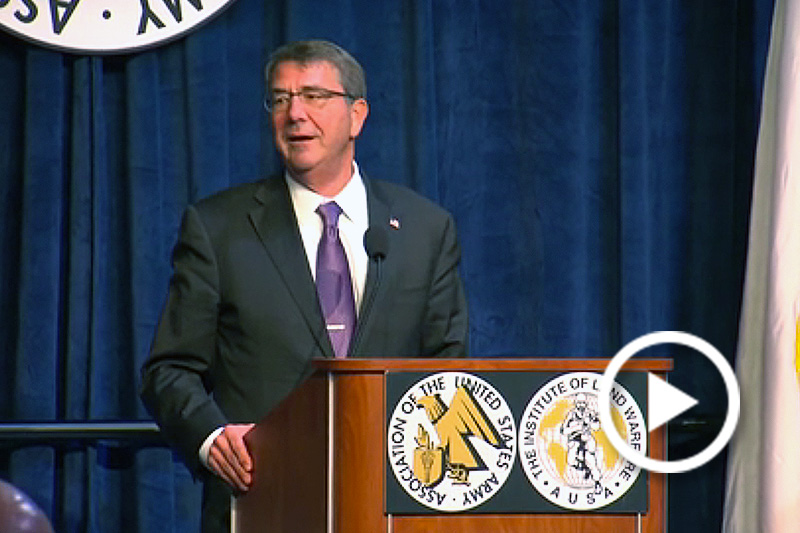 Carter standing behind podium at AUSA Luncheon
