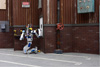 Photo of Team Kaist’s robot DRC-Hubo using a tool to cut a hole in a wall during the DARPA Robotics Challenge Finals.