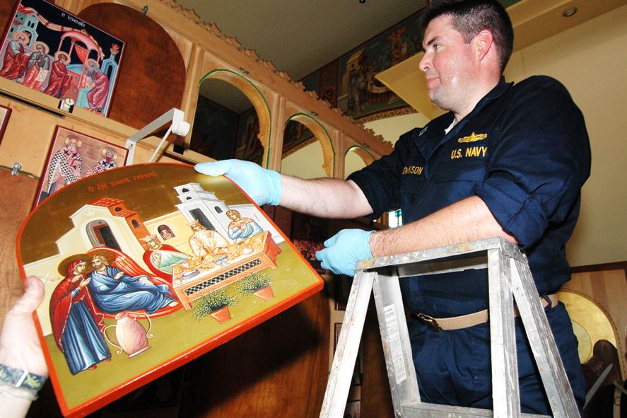 Navy Chaplain Lt. Michael Hendrickson helps clean up the Greek Orthodox Church of New Orleans