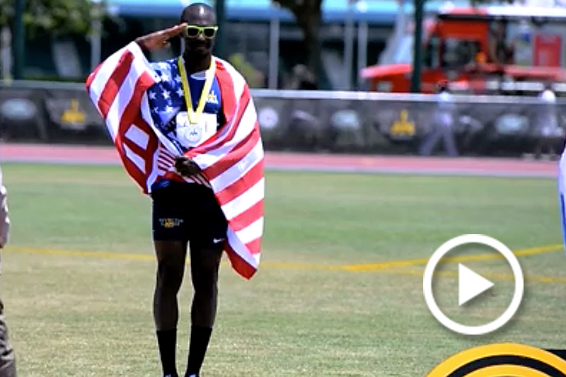Army reservist Staff Sergeant Zedrik Pitts salutes after receiving a gold medal