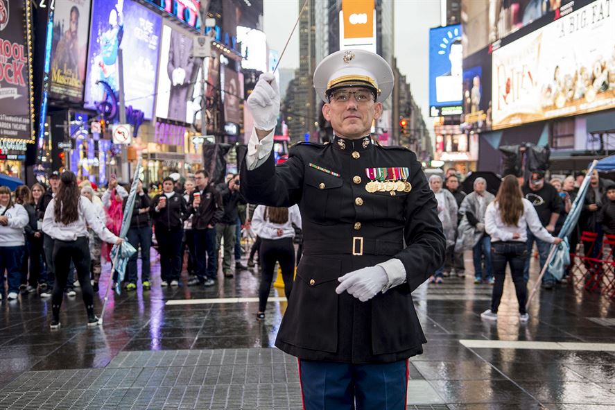 Marine Corps Chief Warrant Officer 4 Robert Sabo, the band director of Marine Corps Base Quantico, leads musicians in New York City