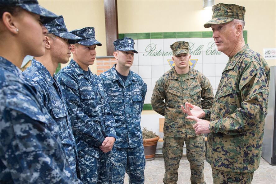 U.S. Marine Corps Gen. Joseph F. Dunford Jr., chairman of the Joint Chiefs of Staff, talks with U.S. service members.