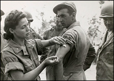 An army nurse Ernestine Koranda instructs Army medics on the proper method of giving an injection, Queensland, Australia, 1942.