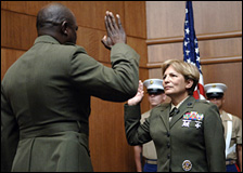 Brigadier General Angela Salinas restates her oath during her promotion ceremony August 2, 2006 aboard Marine Corps Base Quantico, Va.