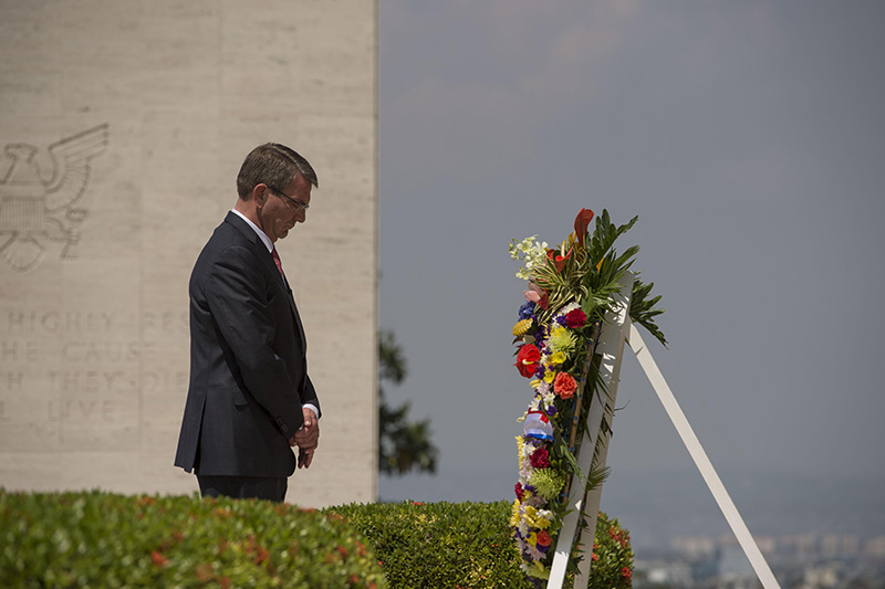 Defense Secretary Ash Carter pausing for a moment of silence after placing a wreath at the Manila American Cemetery.