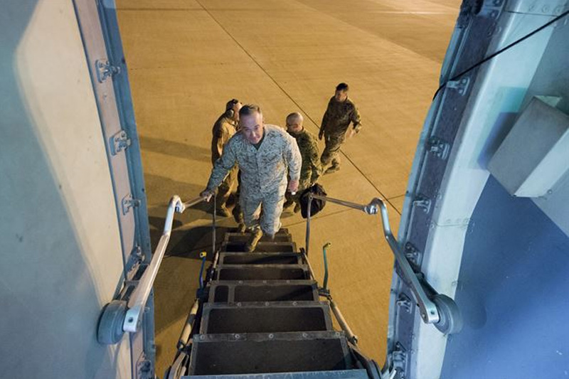 Marine Corps Gen. Joe Dunford, chairman of the Joint Chiefs of Staff boarding an aircraft