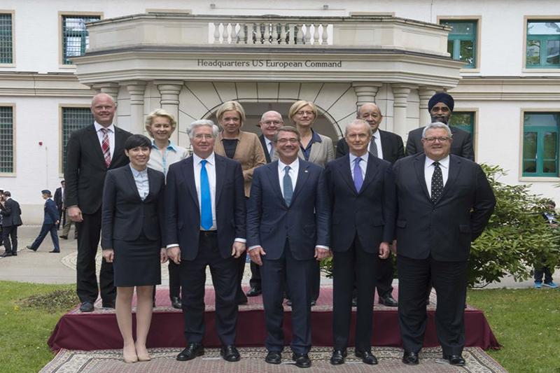 Defense Secretary Ash Carter takes a photograph with defense ministers