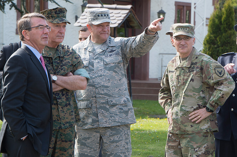 Defense Secretary Ash Carter, left, and Marine Corps Gen. Joe Dunford, second left, chairman of the the Joint Chiefs of Staff, talking with Air Force Gen. Phillip M. Breedlove, center.