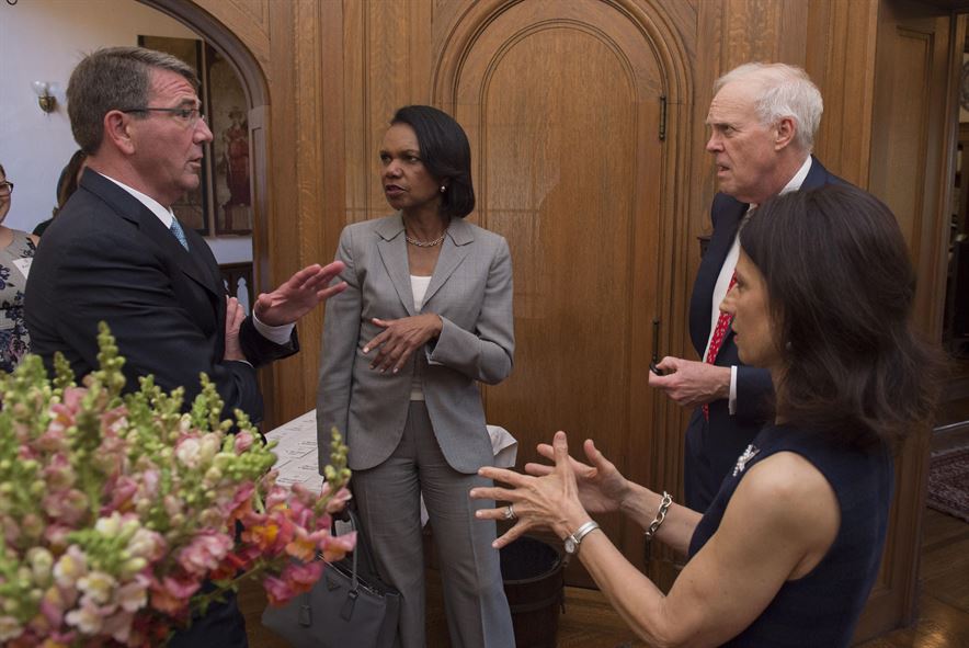 Defense Secretary Ash Carter speaks to former Secretary of State Condoleezza Rice and Stanford University President John Leroy Hennessy