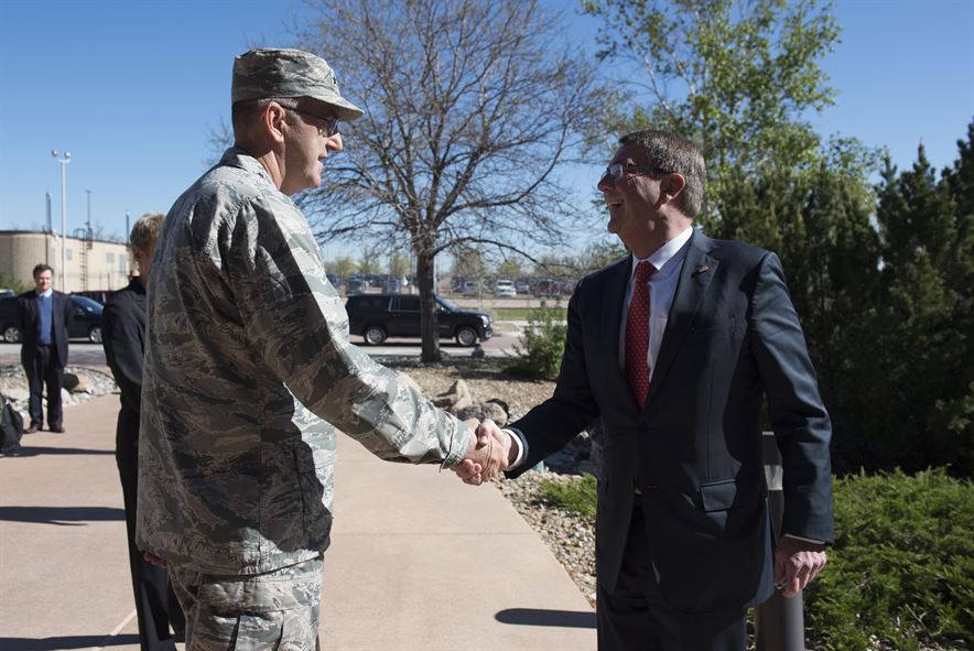 Air Force Gen. John E. Hyten, commander of Air Force Space Command, greets Defense Secretary Ash Carter