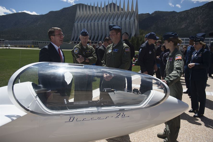 Defense Secretary Ash Carter listens to cadets talk about a training glider