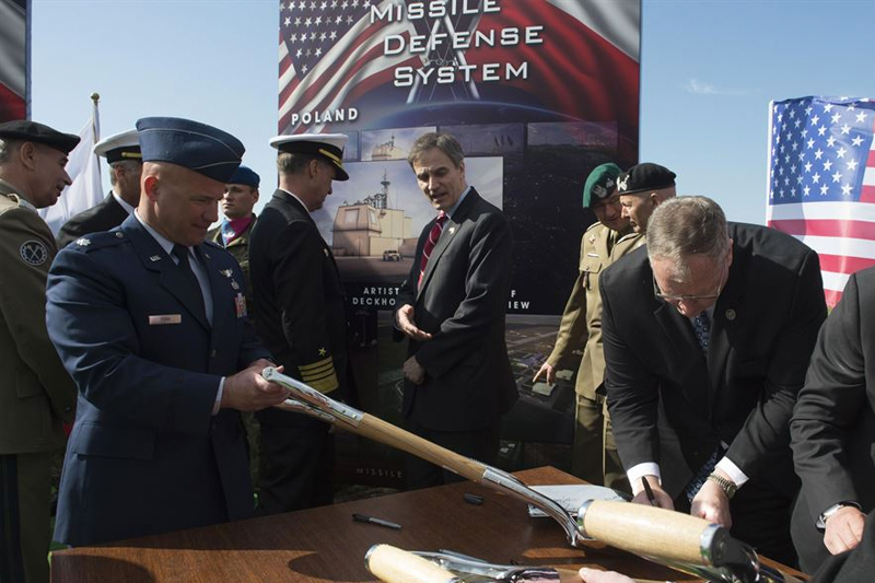 Deputy Defense Secretary Bob Work signs a ceremonial shovel 