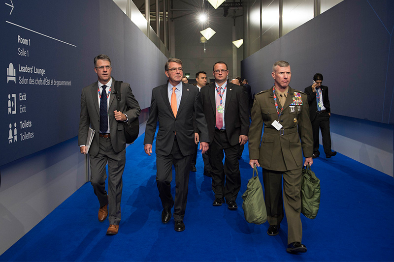 Defense Secretary Ash Carter, second from left, and his staff arrive at the NATO Summit in Warsaw, Poland.