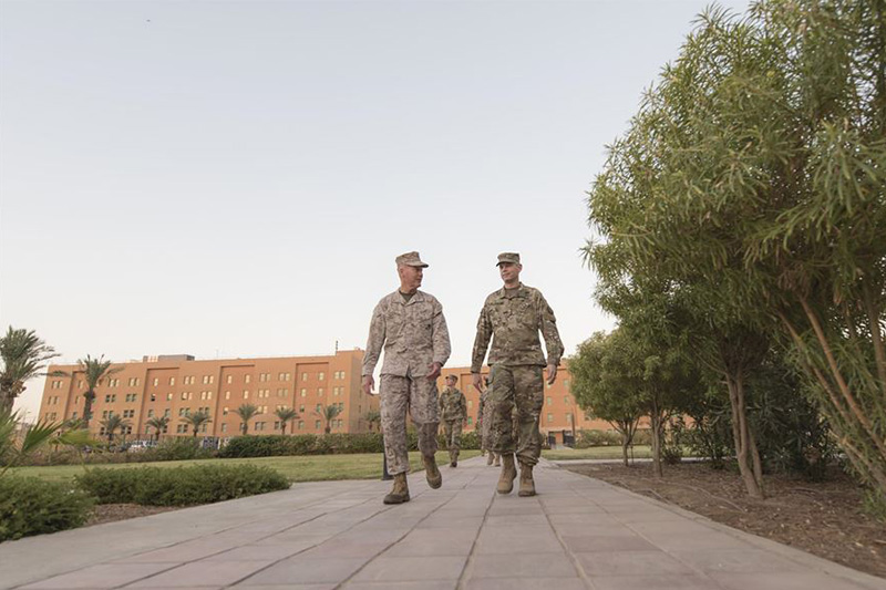 Marine Corps Gen. Joe Dunford, chairman of the Joint Chiefs of Staff, speaks with Army Lt. Gen. Sean MacFarland, commander of Combined Joint Task Force Operation Inherent Resolve.