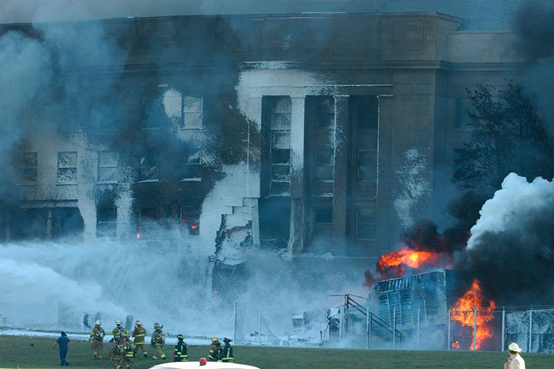 Local police, firefighting units and first responders battle to put out the fires raging in the Pentagon