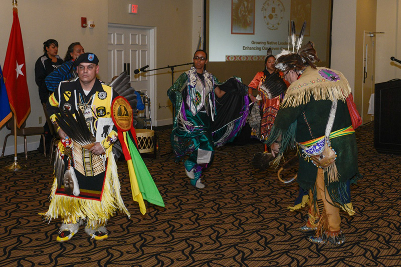 Members of the Red Road Awareness, a nonprofit organization created to assist American Indians in crisis, perform a traditional Native American dance.