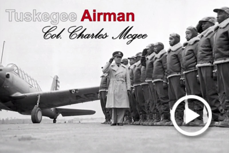Screen grab of Tuskegee Airman Col. (retired) Charles McGee standing with other airmen.