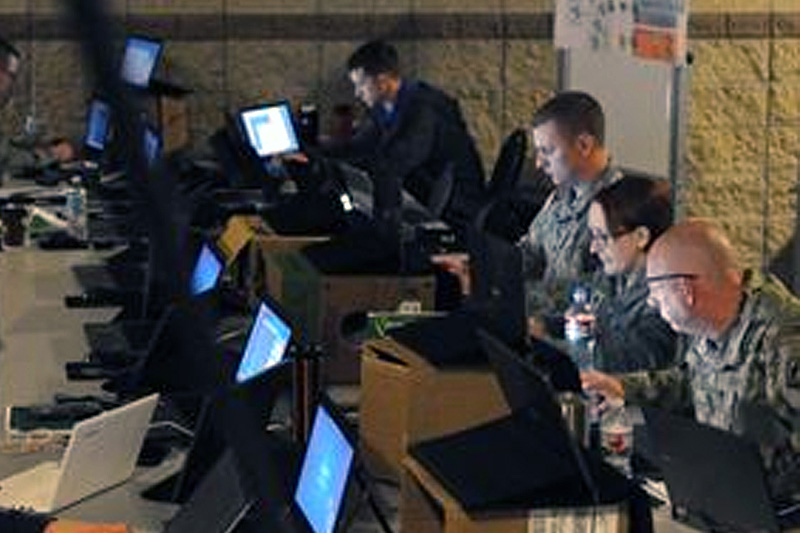 Members of the Army National Guard, Air National Guard, Army Reserve and civilian agencies prepare to engage in cyberattacks
