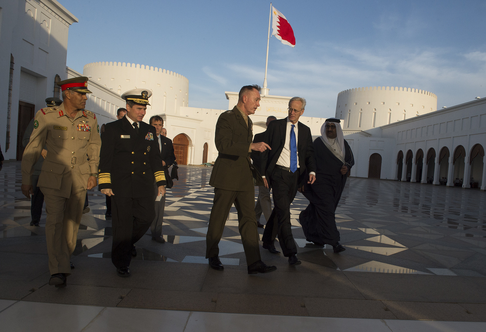 Dunford and Roebuck walking outside the King's Palace in Bahrain