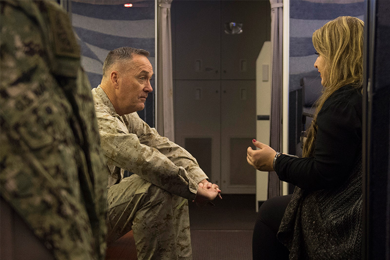 Marine Corps Gen. Joseph F. Dunford Jr., chairman of the Joint Chiefs of Staff, sitting and talking with Jane Horton.