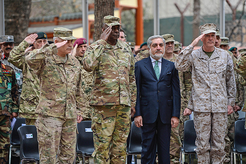 Marine Corps Gen. Joseph F. Dunford Jr., right, chairman of the Joint Chiefs of Staff; Army Gen. John F. Campbell, left, outgoing commander of U.S. Forces Afghanistan and the NATO Resolute Support Mission; and Army Gen. Lloyd J. Austin III, commander of U.S. Central Command, salute and standing with Afghan Chief Executive Officer Abdullah Abdullah during the change-of-command ceremony on Camp Resolute Support.