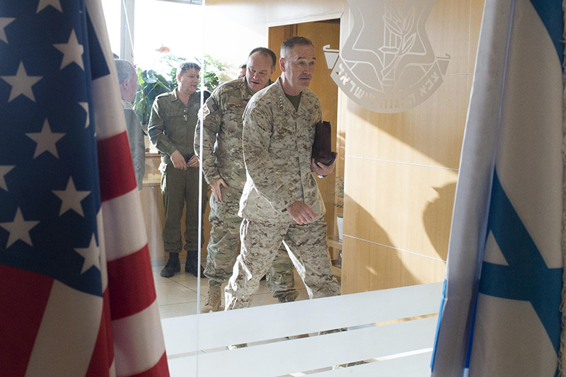 Marine Corps Gen. Joseph F. Dunford Jr., chairman of the Joint Chiefs of Staff walking through a door.