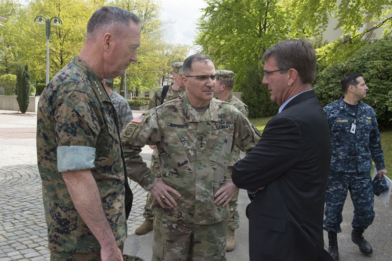Defense Secretary Ash Carter, right, speaking with Marine Corps Gen. Joe Dunford, left, chairman of the Joint Chiefs of Staff, and Army Gen. Curtis M. Scaparrotti, the new commander of U.S. European Command.