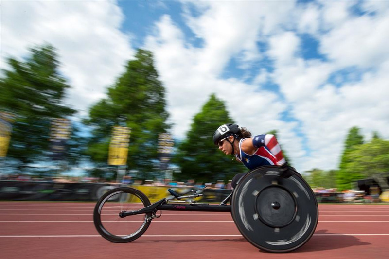 Army Capt. Kelly Elmlinger, a member of the U.S. team, races a wheelchair to victory