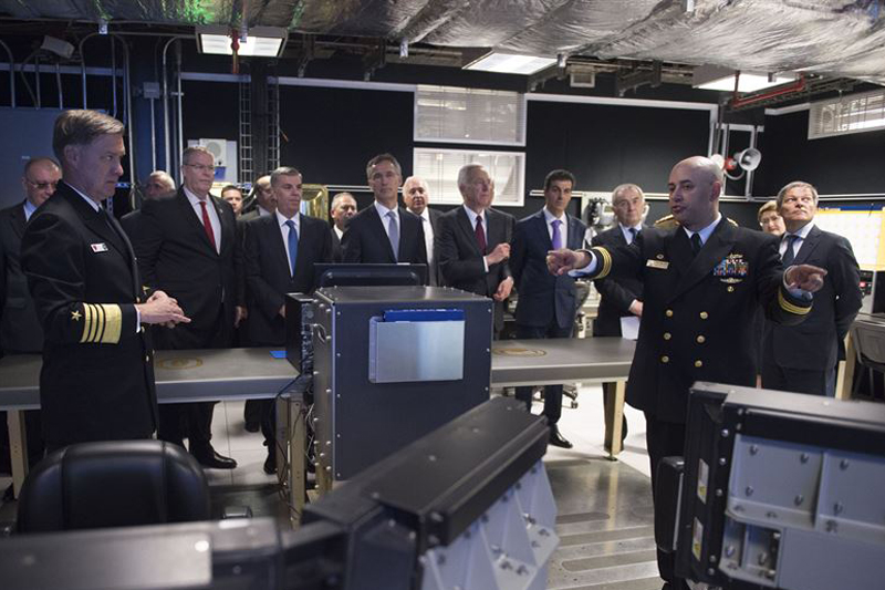 Deputy Defense Secretary Bob Work and other officials listen during a tour of the Aegis Ashore Missile Defense System