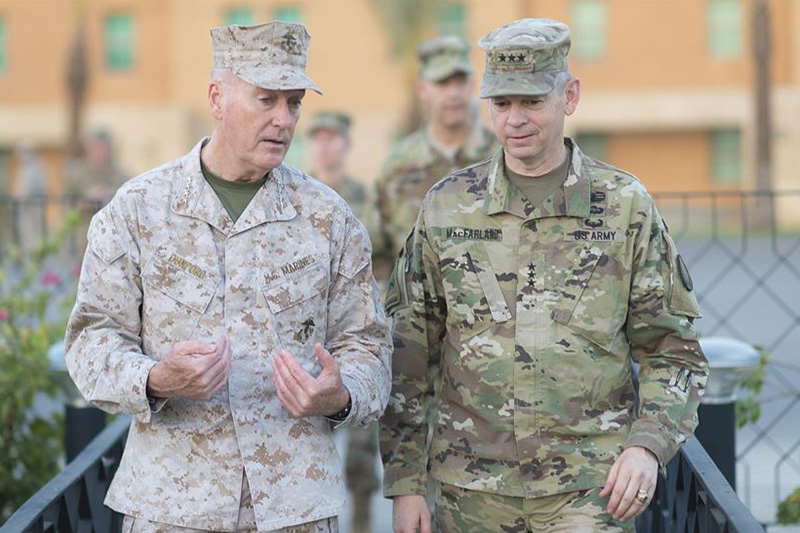 Marine Corps Gen. Joe Dunford, chairman of the Joint Chiefs of Staff, speaks with Army Lt. Gen. Sean MacFarland, commander of Combined Joint Task Force Operation Inherent Resolve.