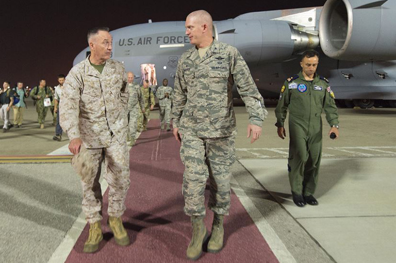 Marine Corps Gen. Joe Dunford, chairman of the Joint Chiefs of Staff, speaks with a member of the U.S. Air Force.