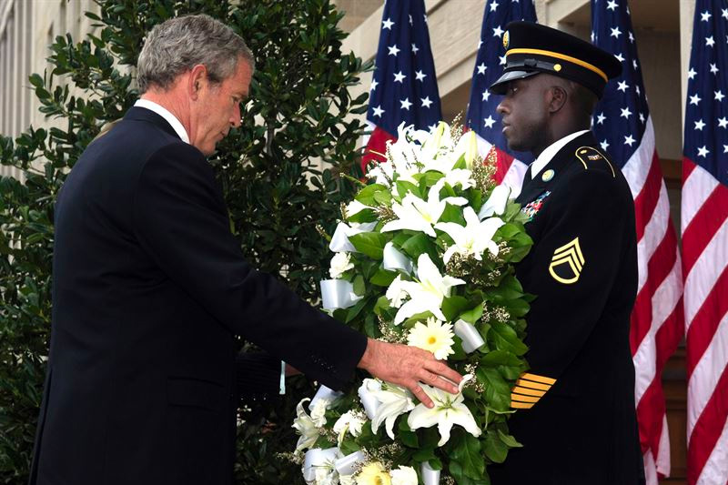President George W. Bush lays a wreath 