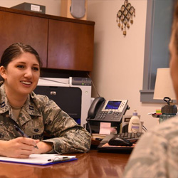 Air Force Capt. Catherine Santiago, Air Force Legal Operations Special Victims’ Counsel attorney, speaks with a client at Malmstrom Air Force Base, Mont., Sept. 30, 2016.