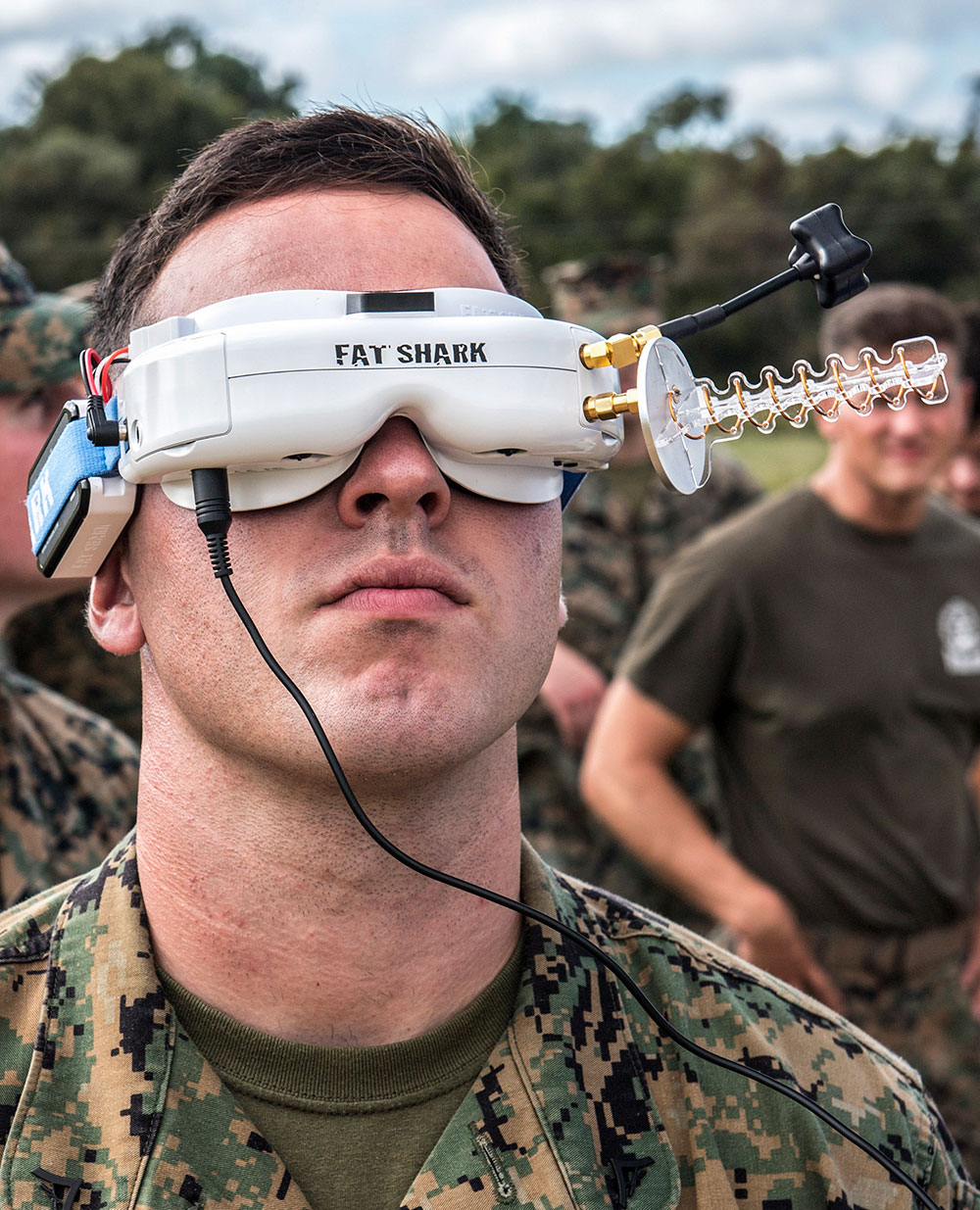 A Marine wears a 3-D printed Army drone prototype over his eyes.